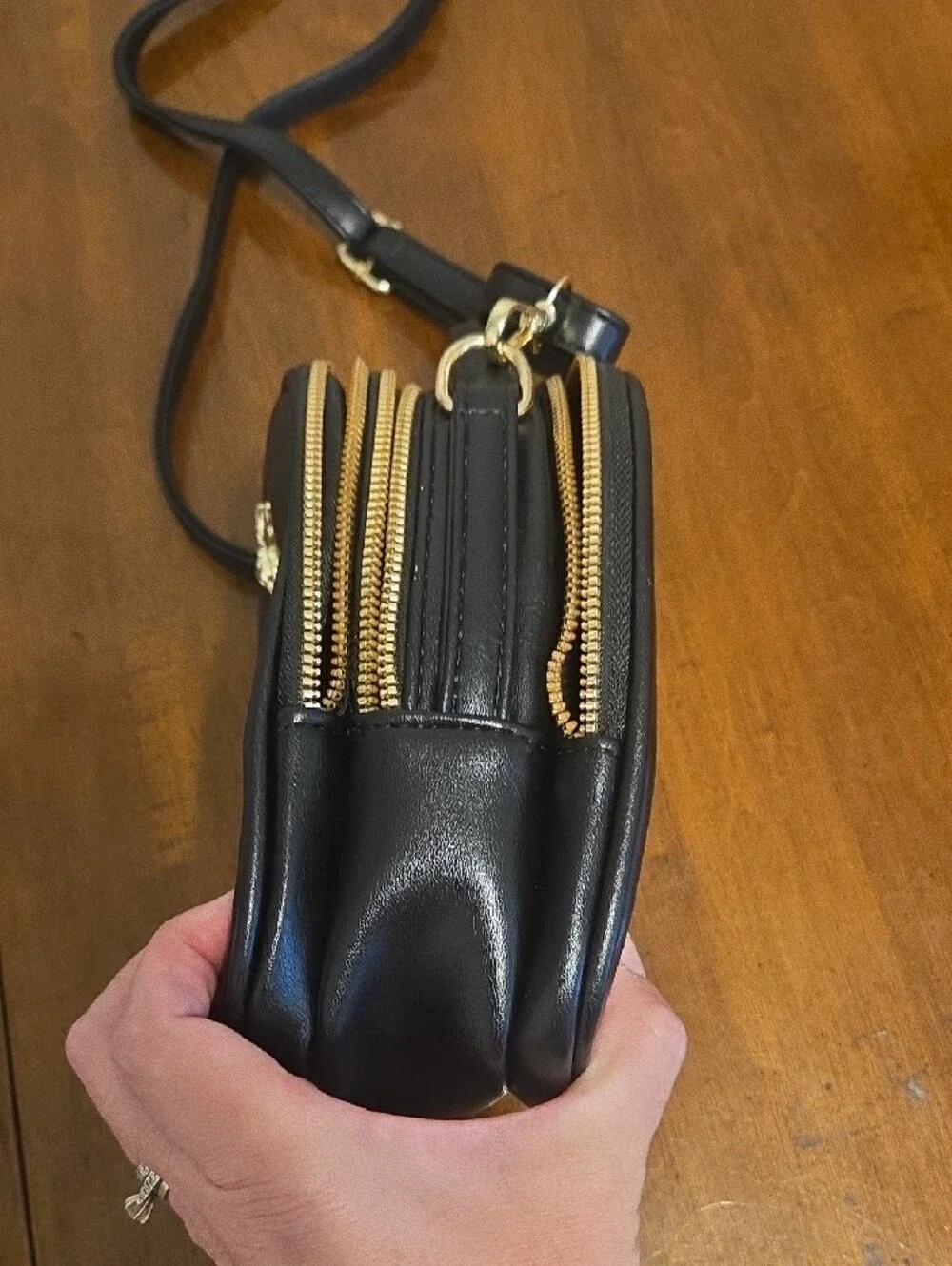Black Crossbody Bag with Gold Bee Emblem